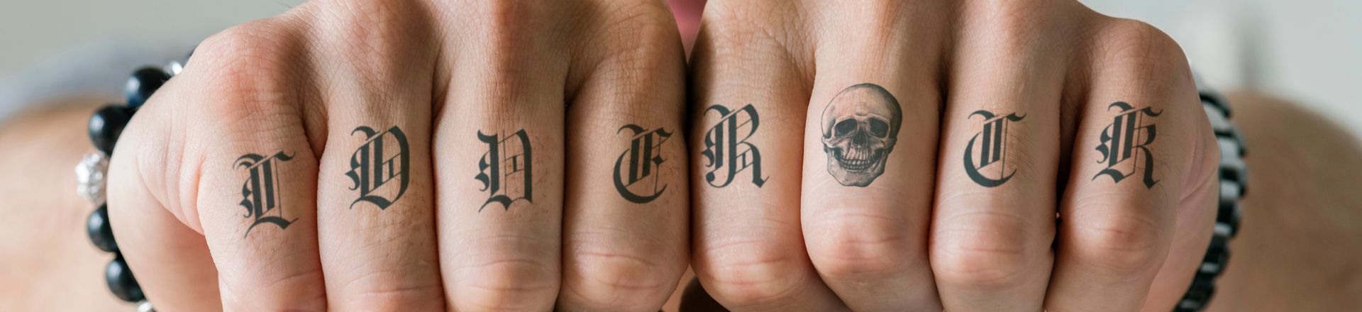 Closeup of knucle tattoos of a man