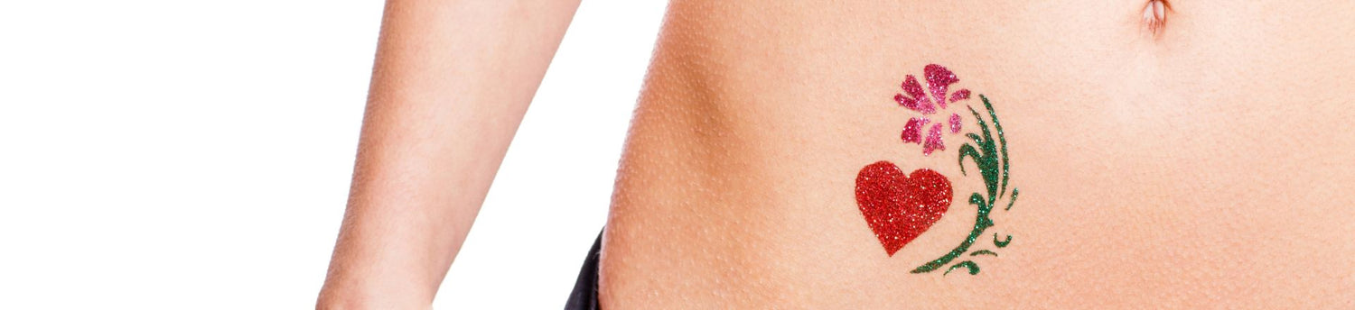 Woman with heart shaped glitter-tattoo isolated