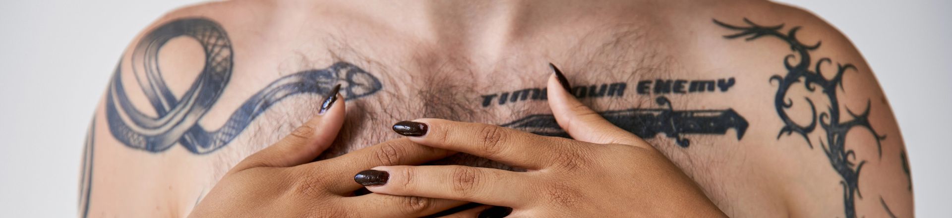 man with americana tattoos on his body