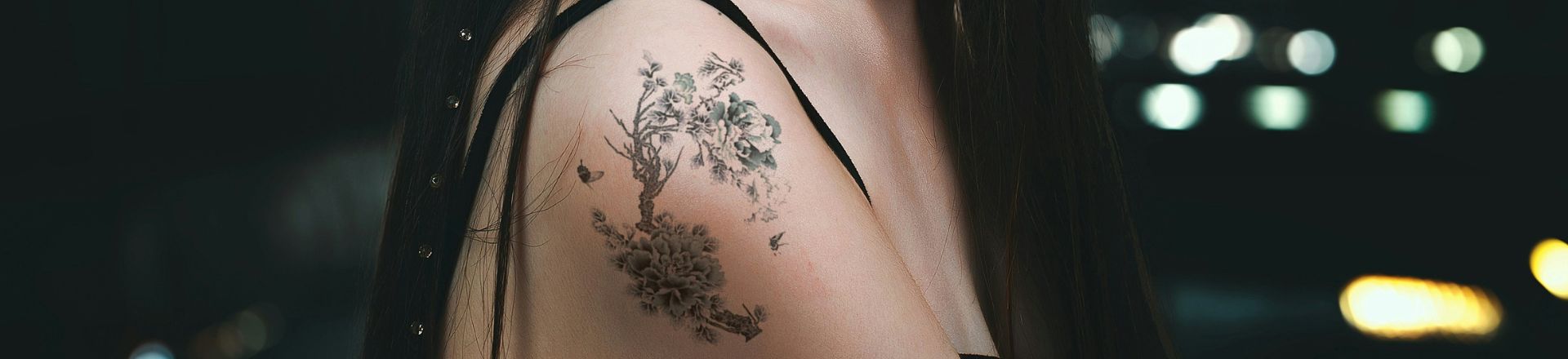 Semi Permanent Tattoos on an Asian woman shoulder