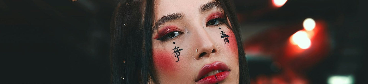 Beautiful woman with temporary tattoo on her face