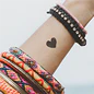black heart tattoo on wrist