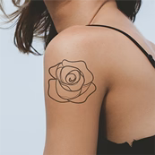 outline rose tattoo on arm