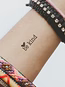 kind tattoo on wrist