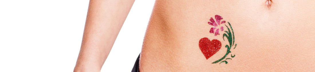 Woman with heart shaped glitter-tattoo isolated 