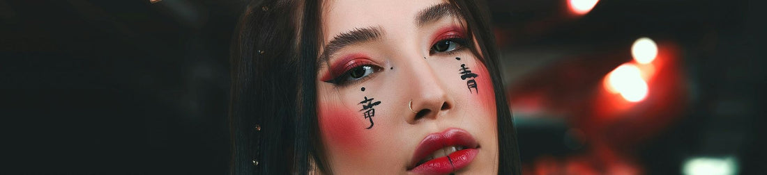Beautiful woman with temporary tattoo on her face