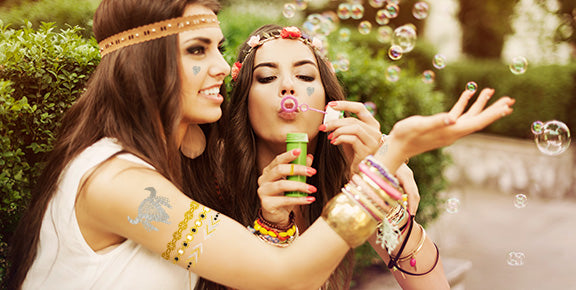 Two woman playing with bubbles