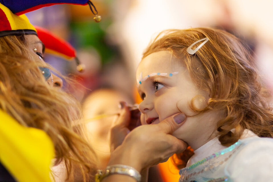girl getting face paint tattoos|
