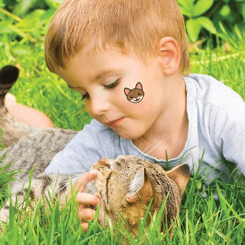 little boy playing with cat learning creativity for kids|kids using temporary tattoos for diy crafts|little girl with temporary tattoos on her arms