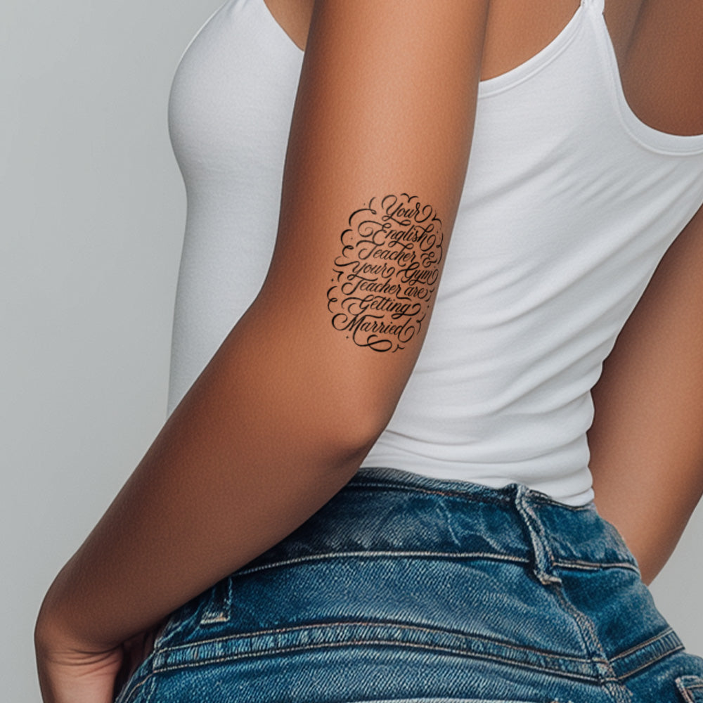 Person wearing a white tank top and blue jeans with a tattoo on their arm.