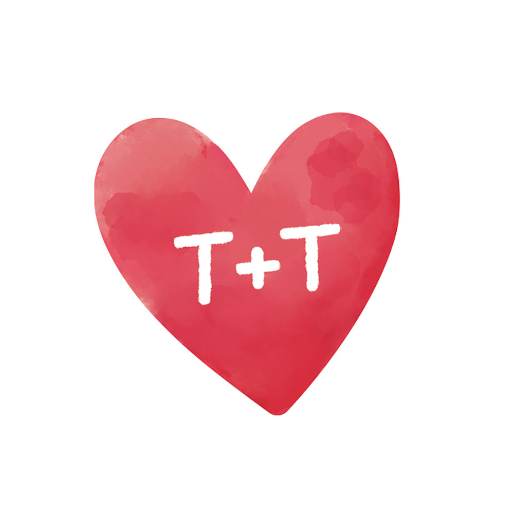 Red heart with 'T+T' in white on a white background