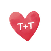Red heart with 'T+T' in white on a white background