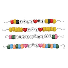Colorful beaded necklaces with letter beads spelling out phrases on a white background