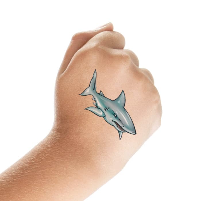 White shark tattoo on the back of the right arm.