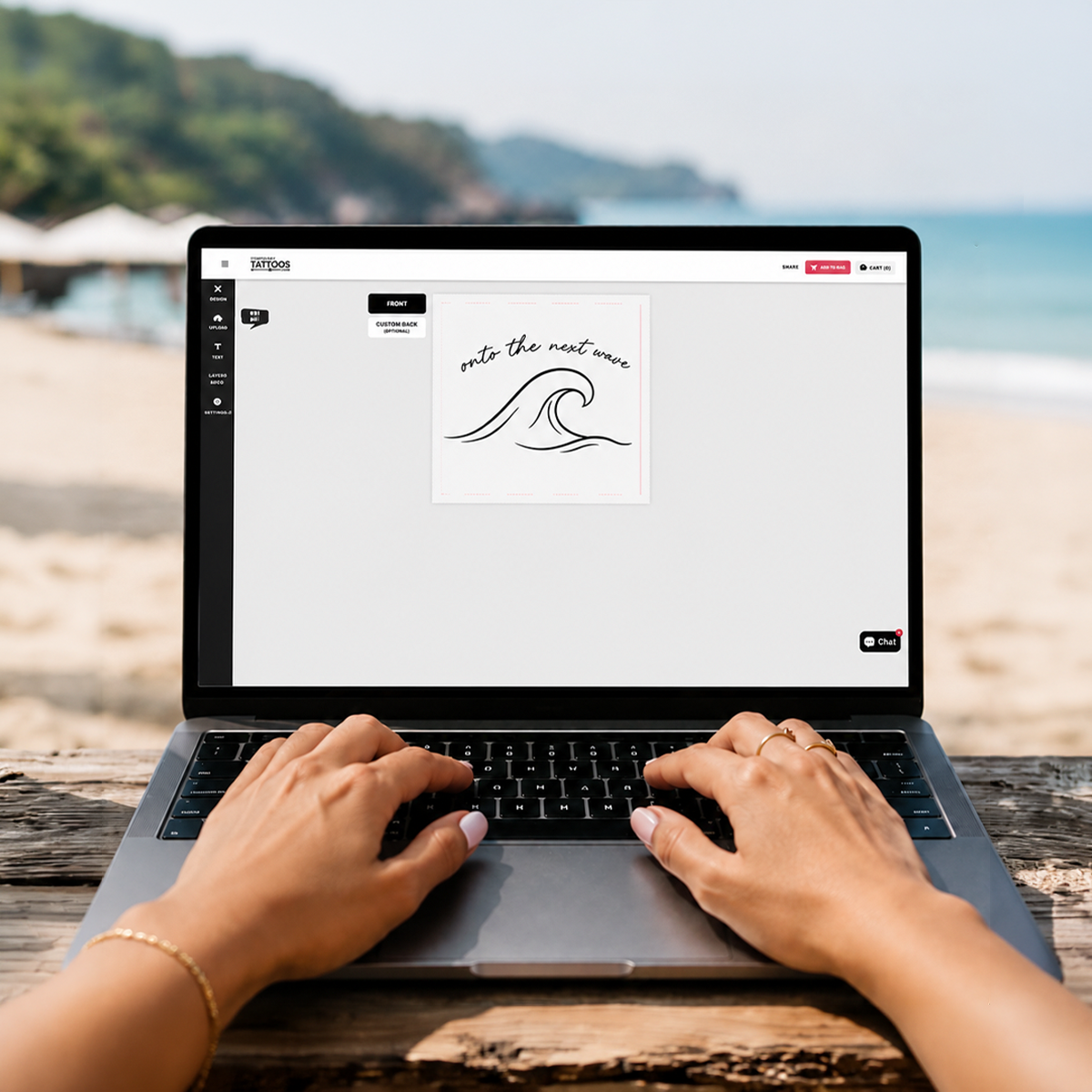Person using a laptop to design a custom tattoo