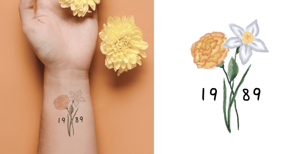 Hand with yellow flowers and a temporary tattoo of flowers and numbers on an orange background.