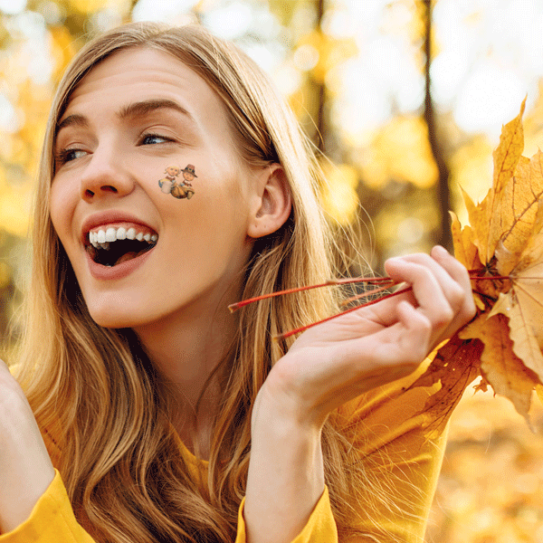 girl with fall temporary tattoos
