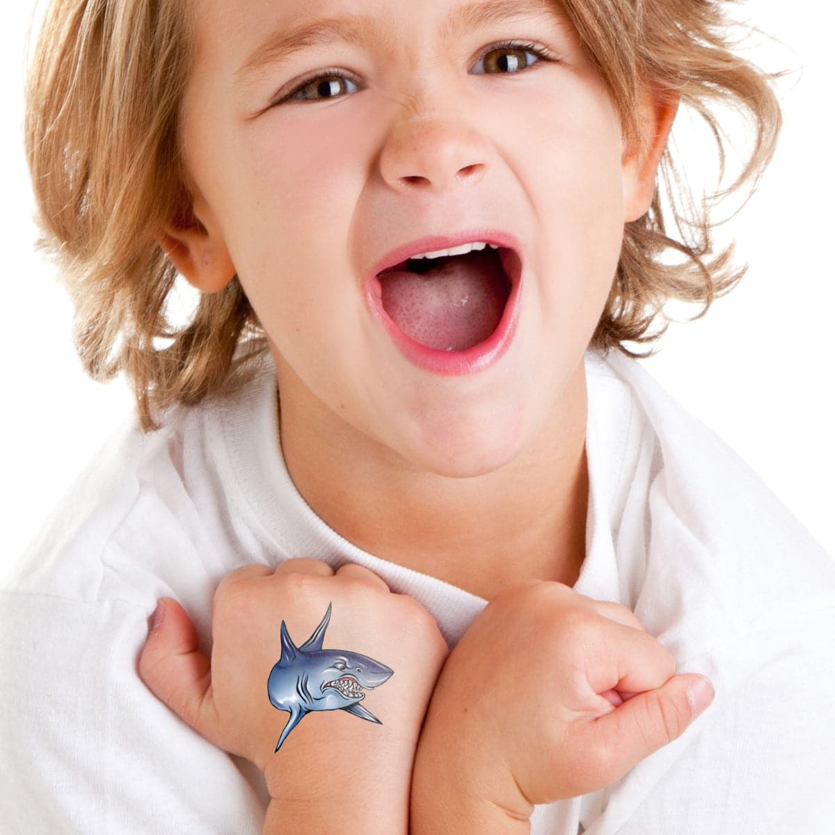 little boy wearing angry shark temporary tattoo