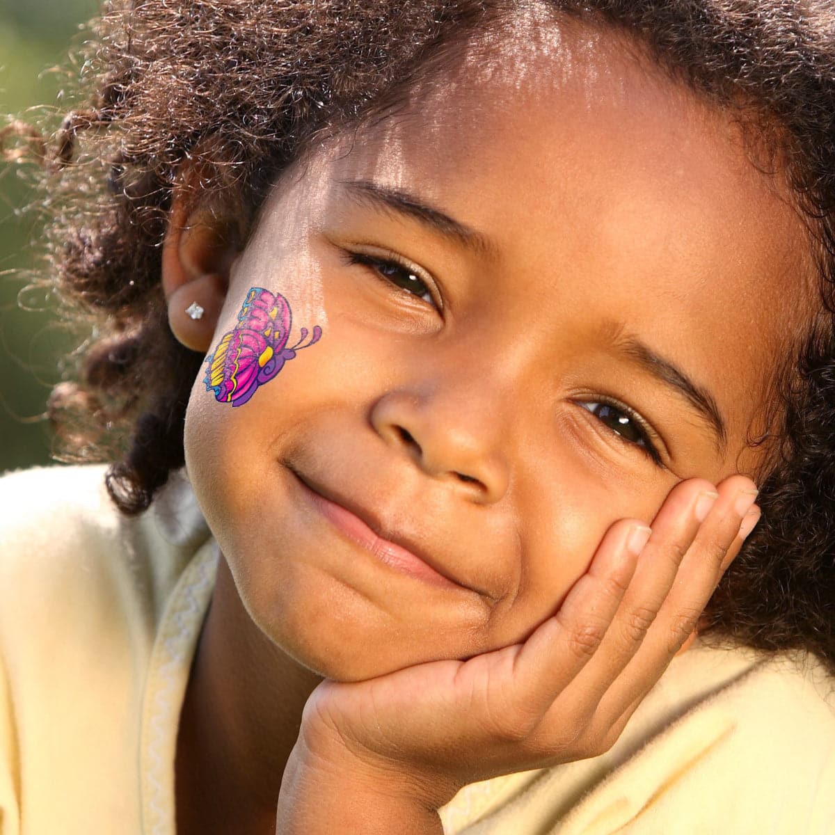 girl wearing buterfly temporary tattoo