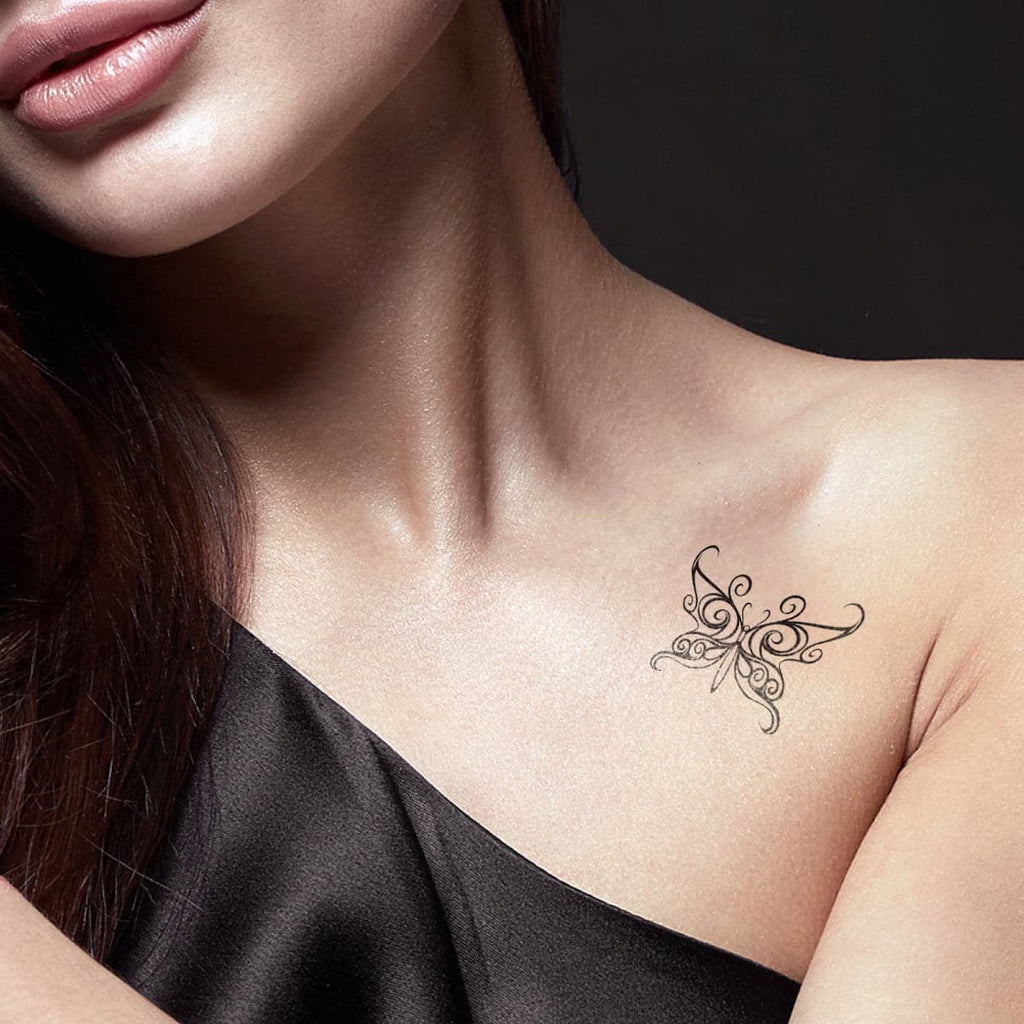 woman wearing black tribal temporary tattoo