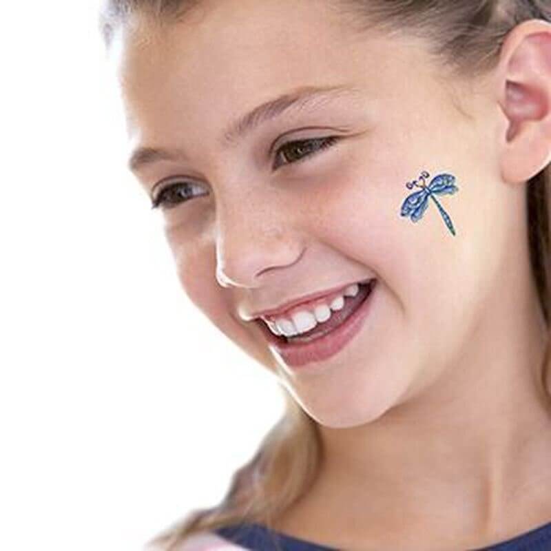 dragonfly temporary tattoo on girls cheek